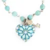 Pulsera de piedras de colores con dije de madera