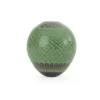 Black clay pot, green paint