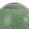 Black clay pot, green paint