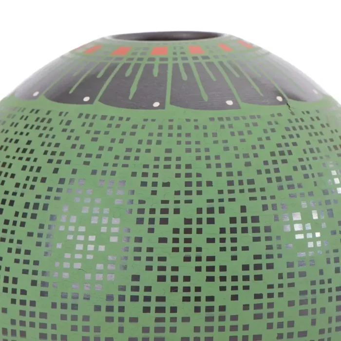 Black clay pot, green paint