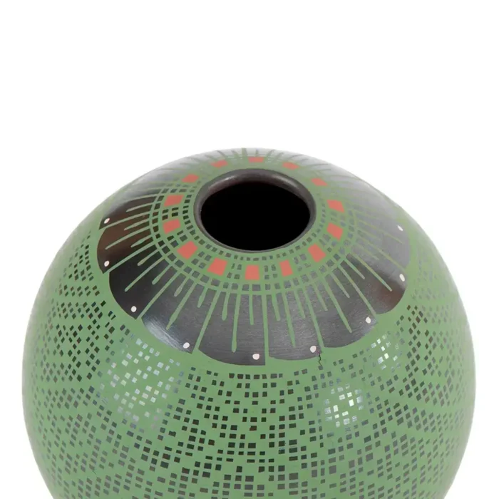 Black clay pot, green paint