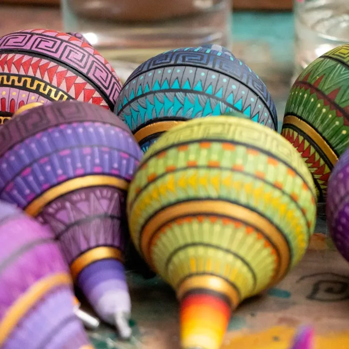 Large wooden spinning top with alebrije-like decoration