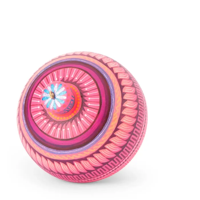 Large wooden spinning top with alebrije-like decoration