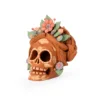 Small red clay skull